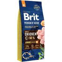 Brit Premium By Nature Junior Medium M - Nourriture complète au poulet pour chiots de races moyennes - 15 kg + nourriture humide avec volaille 6x1240 g