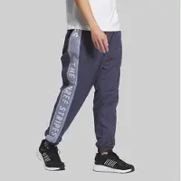 Adidas Pantalon de Survêtement tissé ample Homme avec inscription Shadow Navy