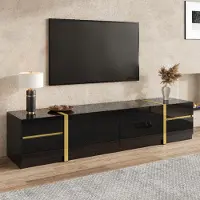 Merax Meuble TV de luxe avec bordures dorées, meuble TV bas à 4 tiroirs et 2 portes, meuble TV de style moderne pour le salon, noir brillant
