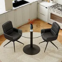 SUCCESS COURIER Lot de 2 comprenant une table à manger ronde en verre trempé, un piètement noir et deux chaises de salle à manger noires enPolyuréthanepivotantes à 360°, dans un style t épuré