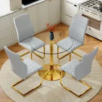 SUCCESS COURIER Lot de 4 comprenant une table de salle à manger ronde en verre trempé de 85 cm de diamètre, avec des pieds en métal doré, et quatre chaises de salle à manger modernes gris clair et dorées