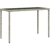 vidaXL Table de jardin avec plateau en verre gris clair 115x54x74 cm Poly rotin