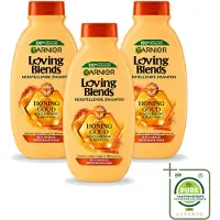 Garnier 3 bouteilles de shampooing Loving Blends, gamme "Honoring Goud", pour cheveux abîmés et fragilisés, format 300 ml - Lot de 3