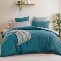 Aisbo Ensemble de literie comprenant une housse de couette réversible de 240x260 cm et deux taies d'oreiller de 65x65 cm, coloris bleu canard/gris
